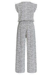 Weißer ärmelloser Jumpsuit mit unregelmäßiger schwarzer Punktmuster, weit geschnittene Hosen und elastischem Bund.