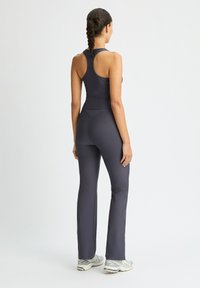 Röhnisch FLARE  - Pantaloni - dk grey plum
