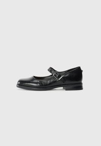 Black leather Mary Jane shoe with a silver buckle strap and low heel, shown from the side on a plain white background.