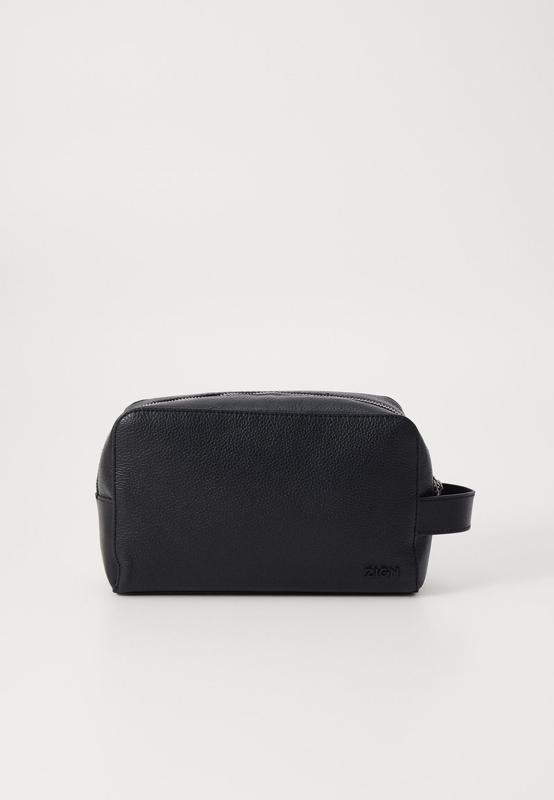 Black leather toiletry bag with a textured surface, rectangular shape, top zip closure, and a side handle for easy carrying.