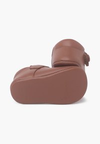 Brown leather shoes with a rounded toe, soft texture, padded upper, and a lightly textured outsole. Features a simple strap closure.