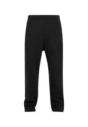 Pantalones de chándal negros con cinturilla elástica, presentando un diseño de pierna cónica y una suave tela de algodón texturizado. Sencillos, sin patrones ni acentos.