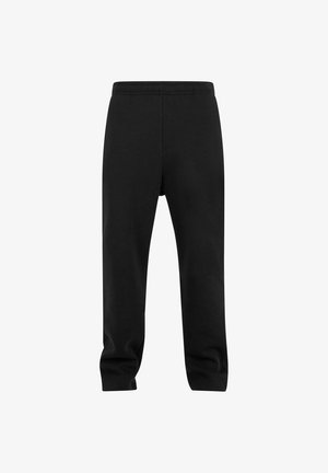 Mustad mustad püksid elastse vöökohtaga, millel on kitsenev jala disain ja pehme, tekstuuriga puuvillane kude. Lihtne, ilma mustrite või aksessuaarideta.