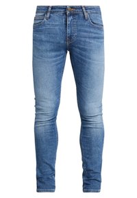 Slim-fit blå denimjeans med blekta detaljer, fem fickor och klassisk knäppning med knapp och dragkedja. Stickade sömmar och lätt stretch.