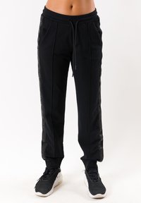 Deha Pantaloni sportivi - nero