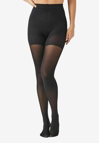 Leggings neri a vita alta con design trasparente, caratterizzati da una finitura liscia e un dettaglio sulla punta. Il materiale è elastico e aderente.