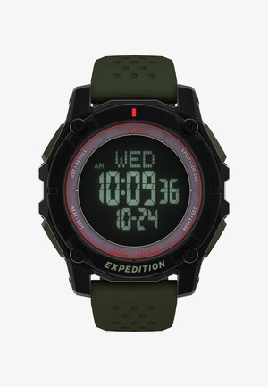 Cyfrowy zegarek z czarną obudową i zielonym gumowym paskiem. Posiada dużą wyświetlacz LCD pokazujący czas i datę. Zawiera możliwość ładowania solarnego oraz przyciski.
