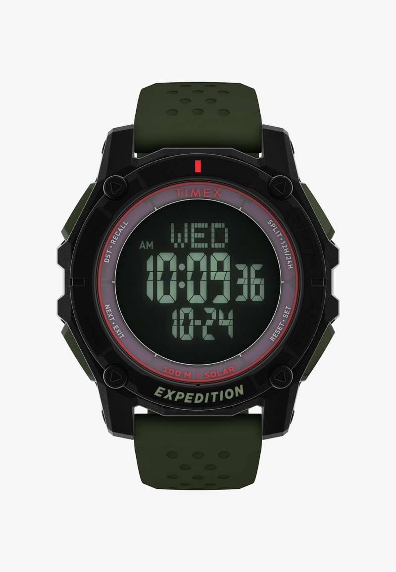 Cyfrowy zegarek z czarną obudową i zielonym gumowym paskiem. Posiada dużą wyświetlacz LCD pokazujący czas i datę. Zawiera możliwość ładowania solarnego oraz przyciski.