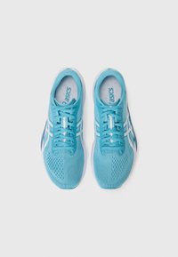 Light blue athletic shoes with a mesh upper, white stripes, and perforated detailing. Features a cushioned sole and lace-up design.