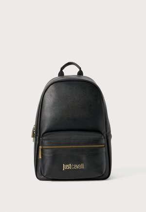 Black leather backpack with a rounded shape, front zippered pocket, gold hardware, and a textured surface featuring the brand name in gold.
