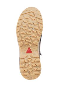 Sål af vandrestøvle med beige gummitræd, der har geometriske former og multicolorprikker, samt et rødt trekantet logo i midten.