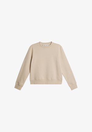 Felpa beige a maniche lunghe con scollo girocollo, polsini e orlo a coste, con un piccolo logo ricamato sul petto sinistro.