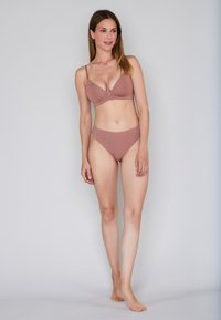 Light brown bikini set featuring a wireless triangular bra and matching high-waisted bottom. Smooth fabric with minimal detailing.