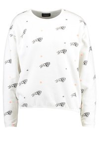 Sudadera blanca con ilustraciones de leones negros y pequeños acentos florales naranjas. Tiene un cuello redondo y mangas largas, hecha de una tela suave.