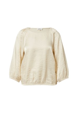 Roomkleurige pullover met een gestructureerde afwerking, ronde hals en oversized mouwen die bij de manchetten zijn geraimd. Label zichtbaar bij de halslijn.