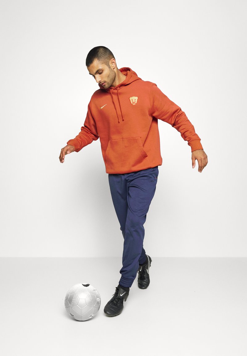 Nike Performance PUMAS CLUB HOODIE - Hoodie - firewood orange/truly  gold/orange - Zalando.ie