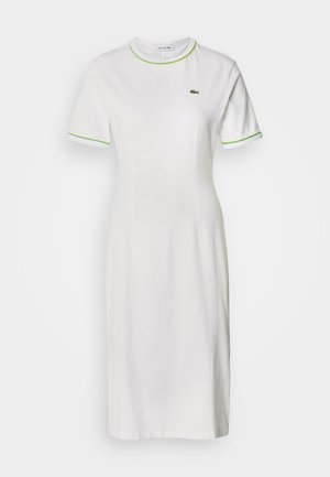 White cotton dress with short sleeves, slim fit, green accents on collar and cuffs, featuring a small embroidered logo on the chest.