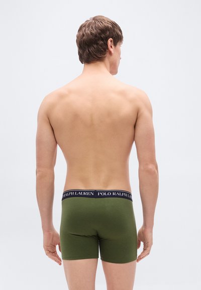 Πράσινα βαμβακερά μποξέρ με μαύρη μέση που φέρει το κείμενο "POLO RALPH LAUREN", προβολή από πίσω σε ουδέτερο φόντο.