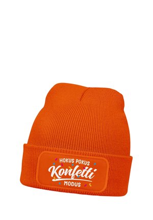 Bright orange knitted beanie with folded cuff, featuring a patch with white text "Hokus Pokus Konfetti Modus" and colorful confetti graphics.