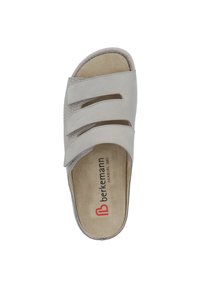 Light gray slip-on sandal featuring three wide straps with cutouts, soft suede material, and a cushioned insole with branding printed inside.