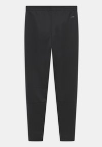 Zwarte sportieve broek van een gladde, rekbare stof met een elastische tailleband. Heeft taps toelopende benen en een subtiele textuurvariatie.