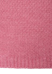 Weiches, strukturiertes pinkes Wollgewebe mit einem gerippten Saum, das ein gewebtes Muster auf seiner Oberfläche zeigt.