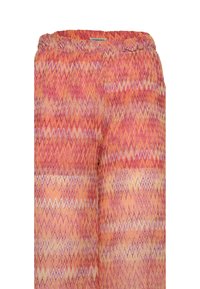Pantaloni a fantasia con un design a zigzag in tonalità di rosa, arancione e giallo. Vita elasticizzata con una vestibilità rilassata. Tessuto dalla texture liscia.