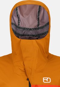 Waterproof orange jacket hood with a pink lining and black patterned trim, featuring a zipper closure and logo on the front.