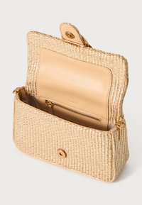 Woven beige handbag with a smooth leather interior, magnetic closure, and a zippered pocket, featuring gold-tone hardware accents.