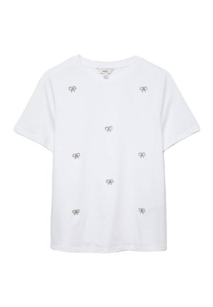 T-shirt bianco a maniche corte con piccole decorazioni a forma di fiocco in strass sul davanti. Realizzato in morbido cotone con scollatura rotonda.