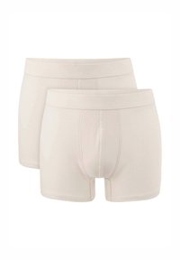 Beige boxer shorts with a smooth texture, featuring a traditional design and stitched detailing. Two pairs shown, one slightly above the other.