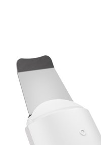 Ultrasonic skin scrubber with angled stainless steel spatula head, white plastic handle, and single round button.