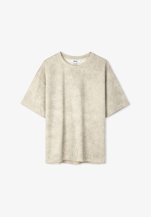 Korte mouwen, ronde hals t-shirt in lichtbeige stof met een subtiel stippenpatroon, relaxte pasvorm en zachte textuur, geschikt voor casual gedragen.