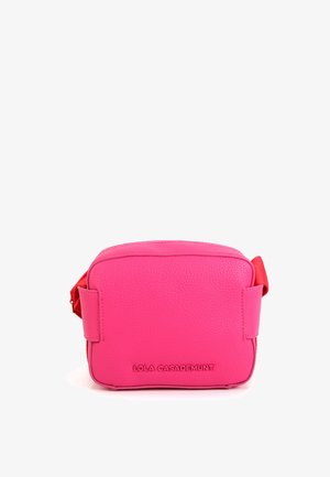 Pink leather crossbody bag with a rectangular shape, smooth texture, and a contrasting red accent on the side. Features brand logo on front.