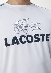 Lacoste Sport T-Shirt sport - white/hydro sierra red