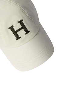 White baseball cap with a black embroidered letter "H" on the front panel, shown against a white background.