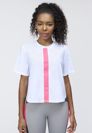 White short-sleeve shirt with a central pink stripe, featuring a round neckline and a loose fit, paired with gray leggings with pink accents.