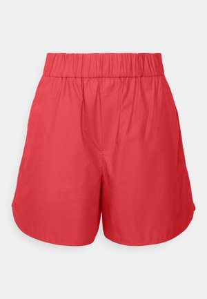 Rote Shorts mit elastischem Bund aus glattem Material, die eine lockere Passform und abgerundeten Saum für Komfort und Bewegungsfreiheit bieten.