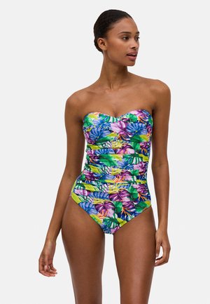 Bañador sin tirantes de una sola pieza con un vibrante estampado tropical de hojas verdes y acentos morados, confeccionado en un material suave y elástico.