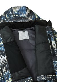 Chaqueta Reima con un exterior multicolor y estampado con puntos azules, blancos y negros. Interior forrado con una suave tela gris.