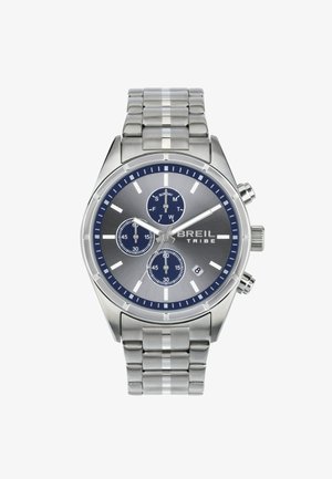 Montre chronographe en acier inoxydable avec un cadran argenté et bleu marine, trois sous-cadrans, affichage de la date et bracelet en maillons métalliques.