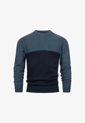 Kötött pulóver, magas környakkal, színblokkos dizájnnal kék és sötét tengerészkék árnyalatokban, texturált anyaggal, bordás mandzsettákkal és alsó szegéllyel.