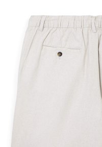 Light beige, linen blend trousers with an elastic waistband and a back pocket featuring a round, dark button detail.