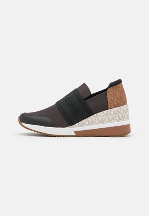 Slip-on wedge sneaker in brown and black fabric with branded elastic strap, patterned heel panel, white midsoles, and rubber outsole.