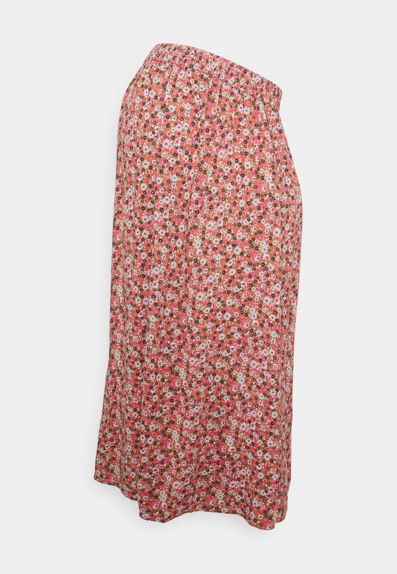 Jupe longueur genou avec taille élastique, présentant un motif floral dense en rose, blanc et noir sur un fond marron clair.