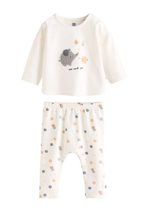 Ensemble deux pièces en coton. Haut à manches longues crème avec motif éléphant texturé et texte « moi et toi ». Pantalon assorti à pois multicolores.
