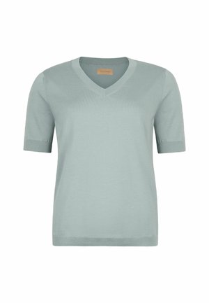 Jasnoniebieska dzianinowa bluzka z krótkim rękawem, dekoltem w kształcie litery V i prążkowanymi mankietami oraz dołem, przedstawiona na białym tle.