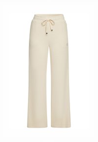 Beige weite Hose aus weichem Strickstoff, mit elastischem Bündchen und Kordelzug sowie zwei seitlichen Taschen. Dezente Markenkennzeichnung an der Tasche.