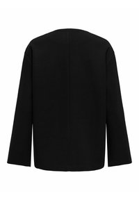 Vêtement d'extérieur noir à manches longues, présentant une coupe droite, un tissu texturé et un design minimaliste sans fermetures ni accents visibles.