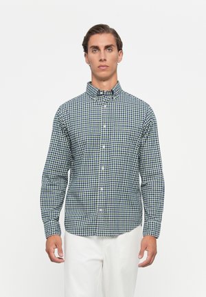 Kariertes Button-down-Hemd in Grün und Marineblau, aus einem Stoff mit sichtbarer Struktur, mit einem Kragen und langen Ärmeln.